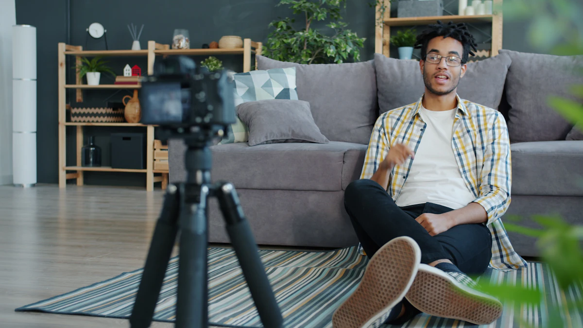 Man recording himself with a camera at home