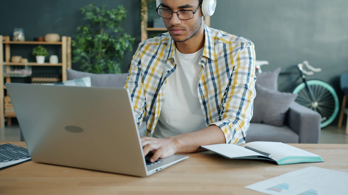 Student wearing headphones learning online with a laptop