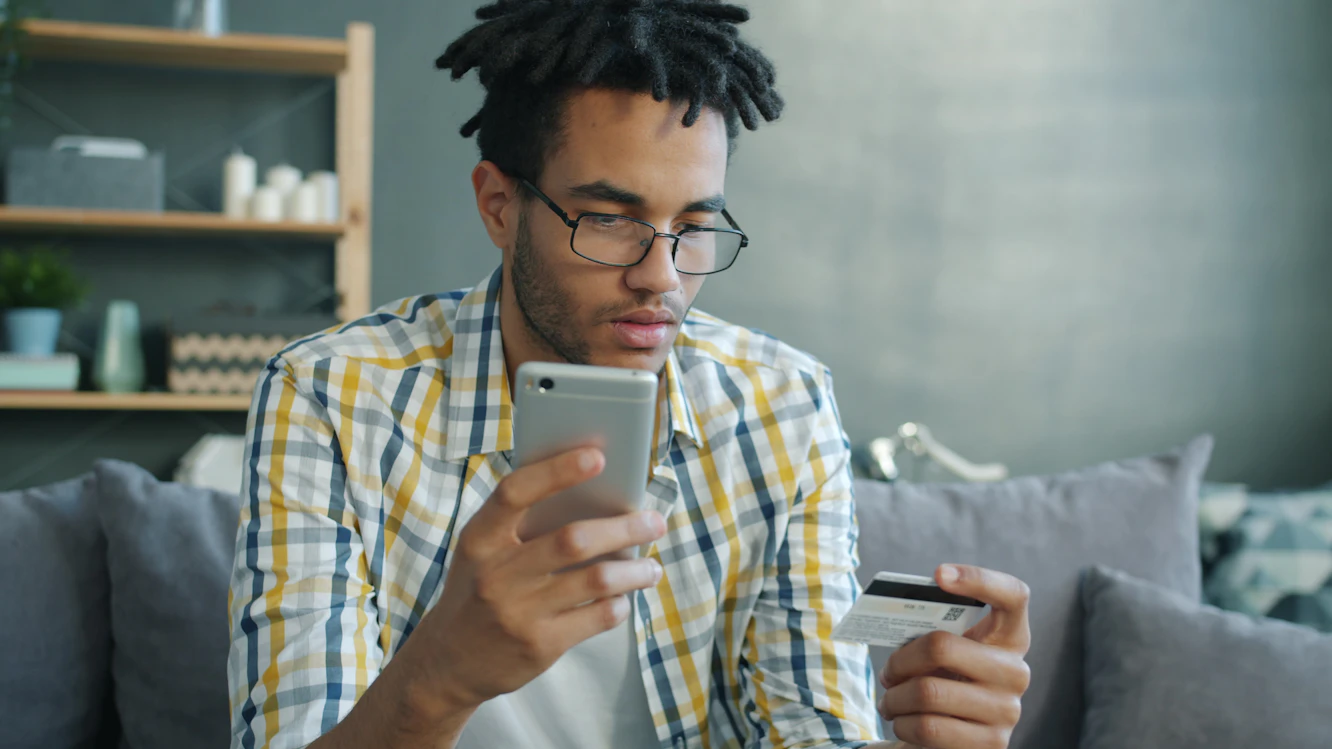 Consumer reviewing credit card utilization and account balances