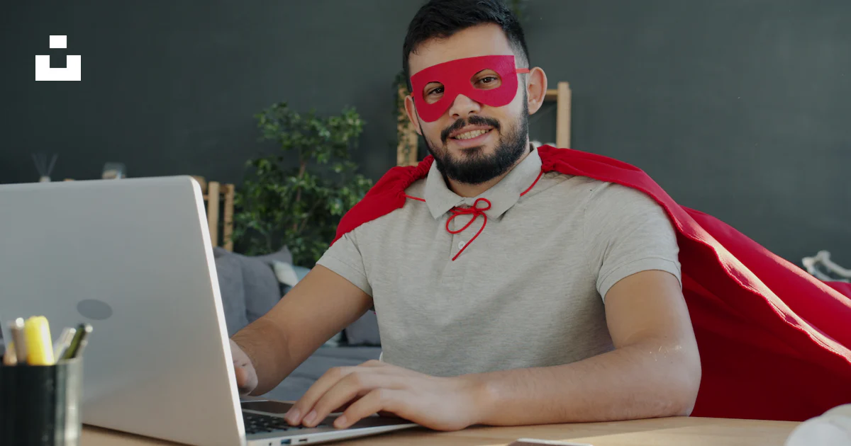Working Superhero Man in superhero costume working on laptop photo – Free Motivation ...