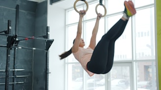Woman performing an exercise on gymnastic rings