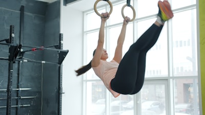 Woman performing an exercise on gymnastic rings