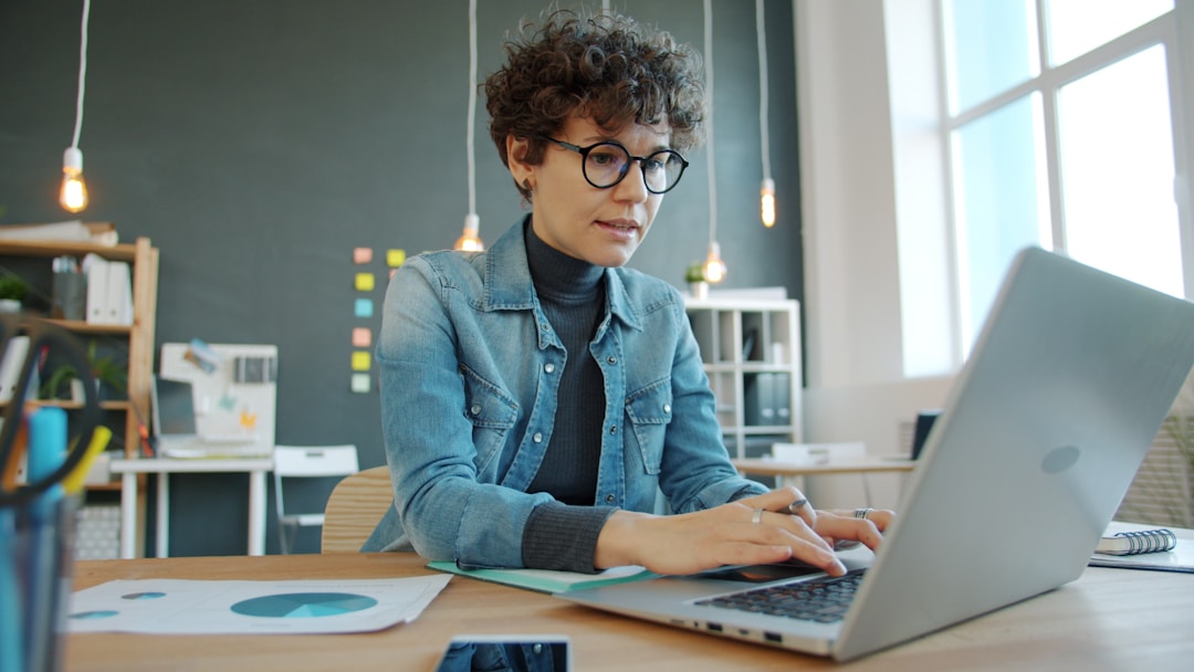person working on laptop at desk