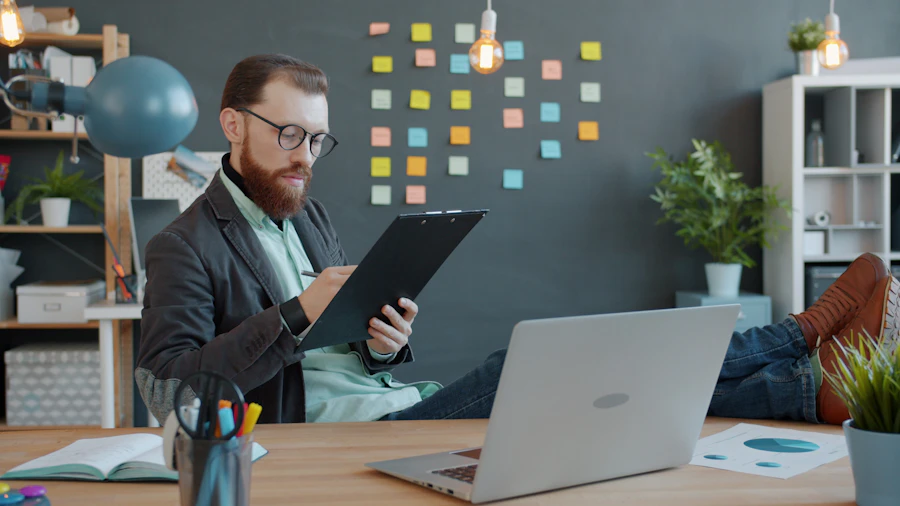 A founder working on a laptop at a desk in a modern workspace