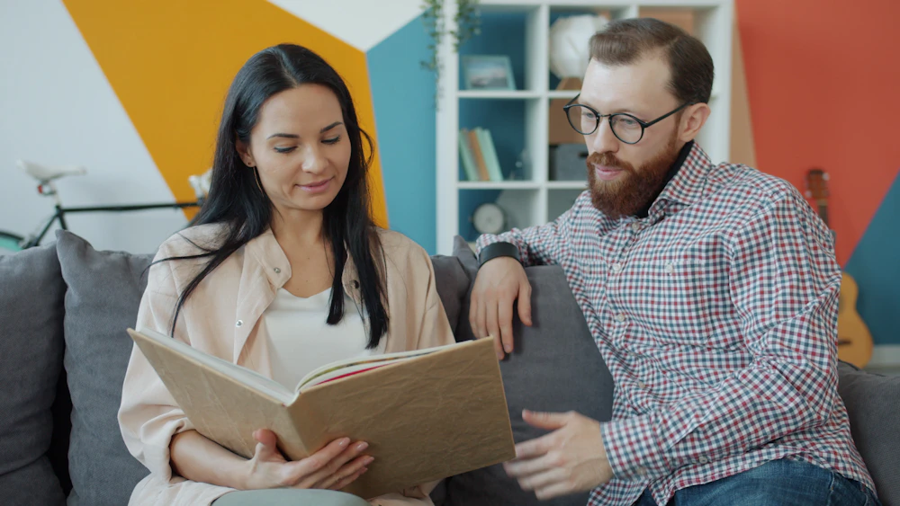 Couple looking through shared photographs