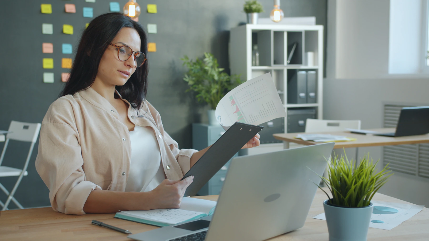 Professional reviewing organised documents in a calm office