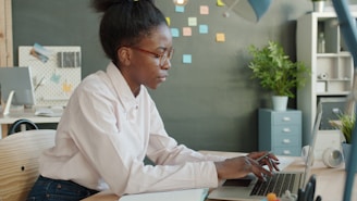 Young woman working on laptop in office