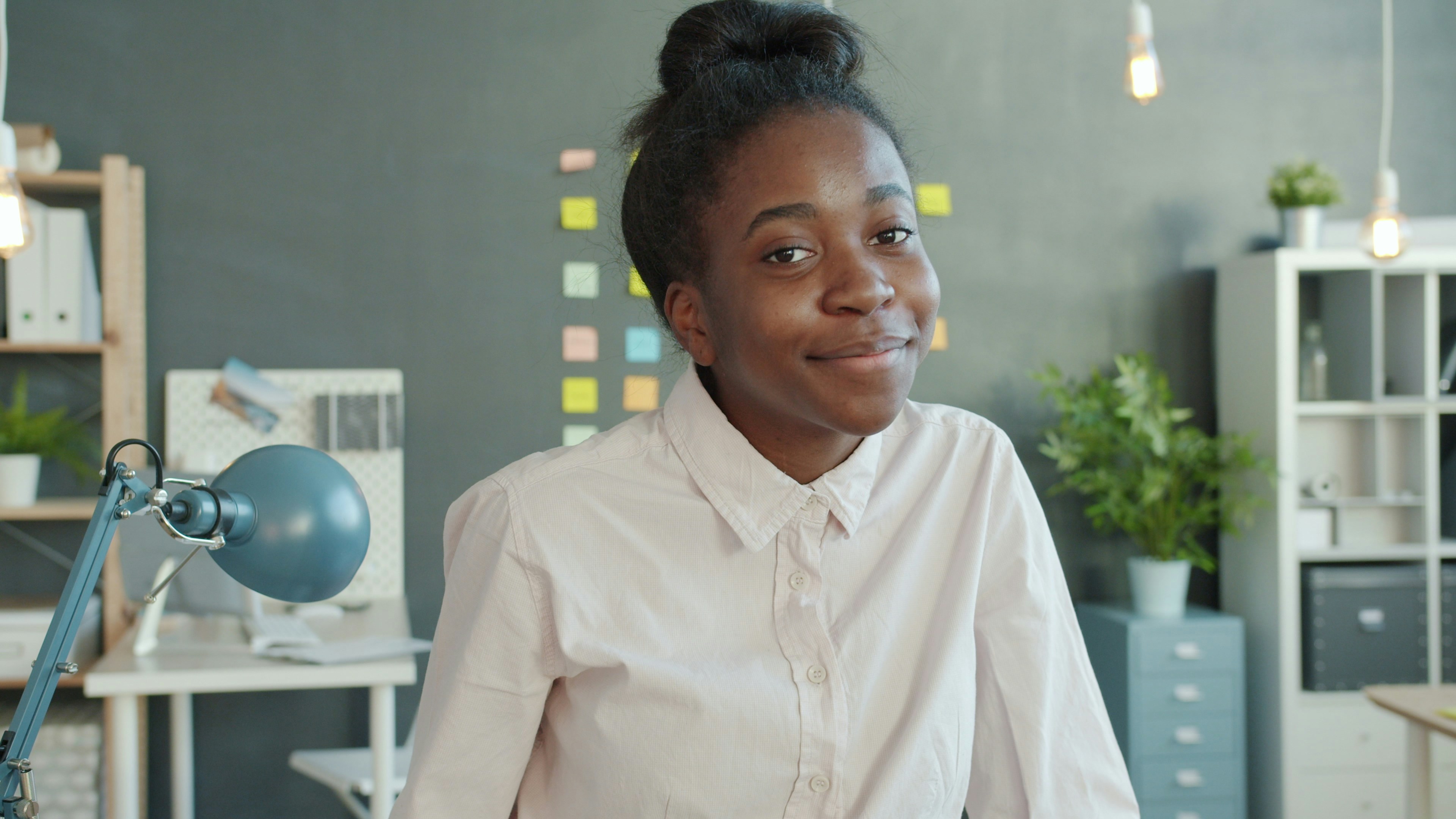 Young woman smiling in an office setting