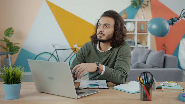 Business owner working on a laptop in a modern workspace