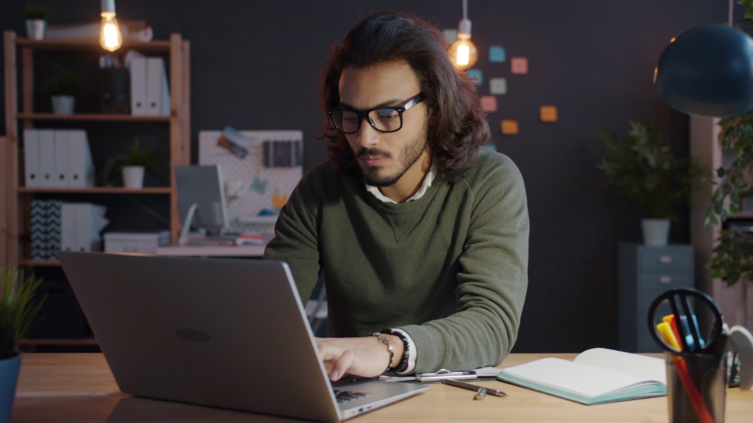 ghostwriter managing X reply workflows for multiple clients at a desk