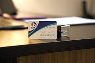 Business card and stamp on a desk