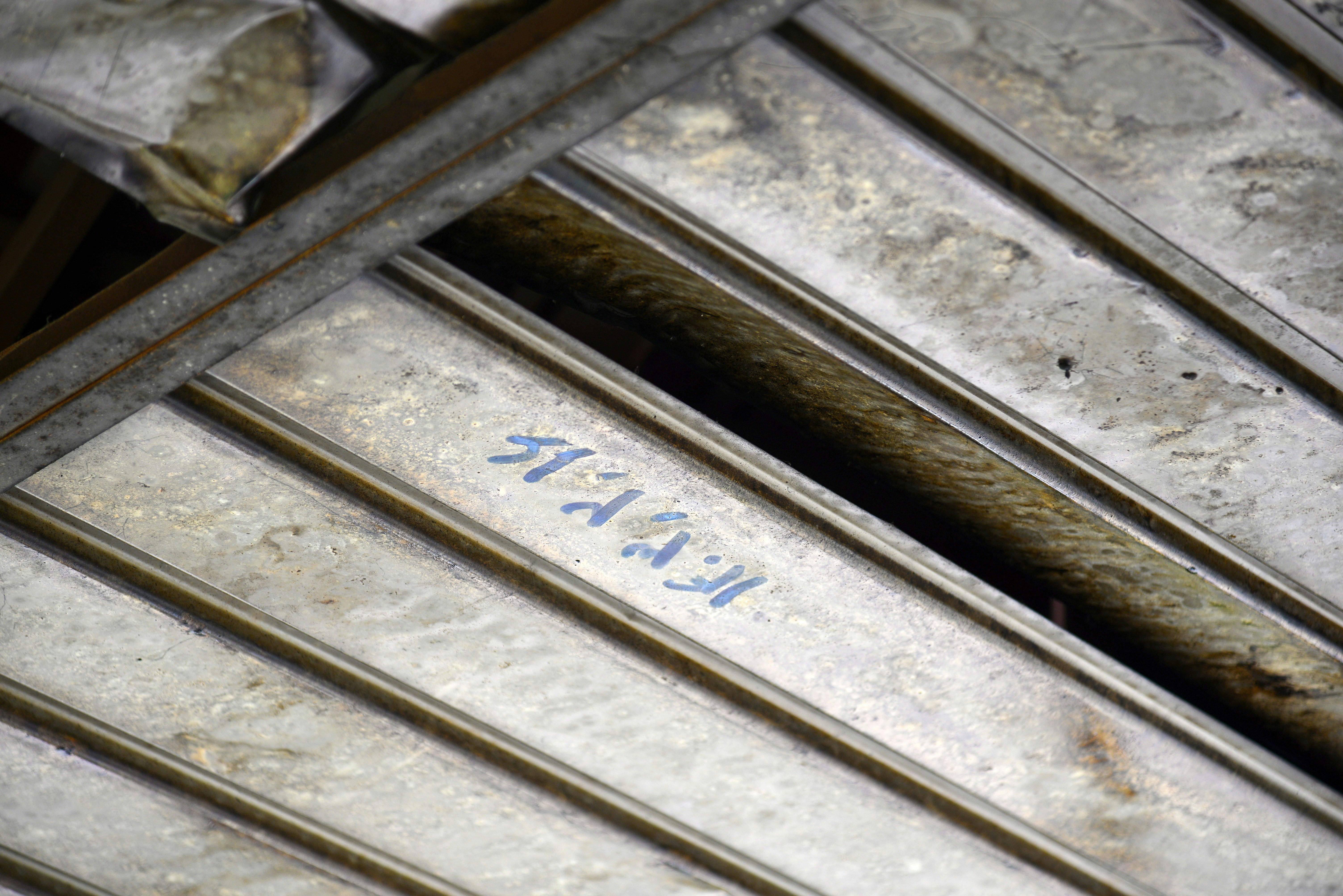 Corrugated metal ceiling with blue markings