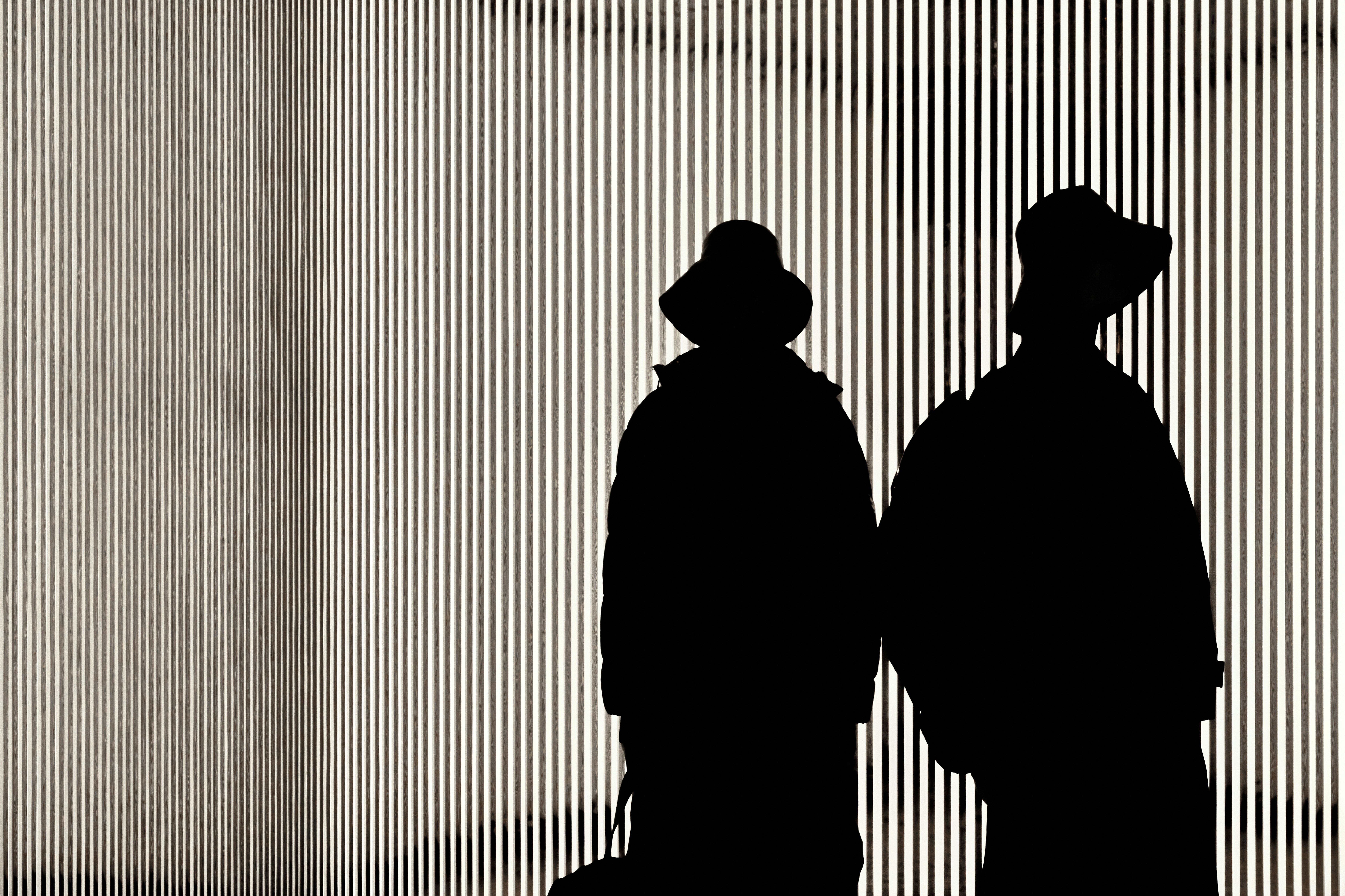 Shadows of 2 people on a wall