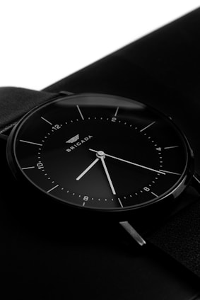 A sleek black wristwatch with a minimalist design
