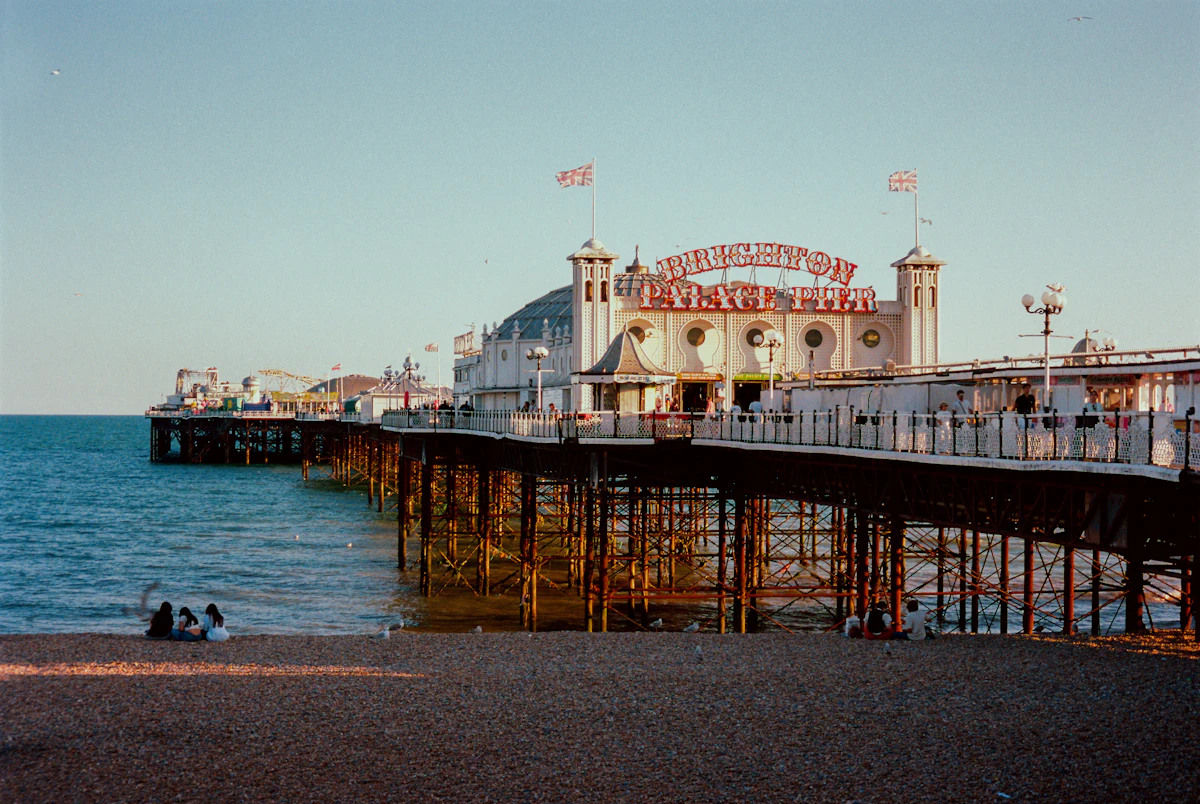 Coastal street of pale seafront buildings in soft light