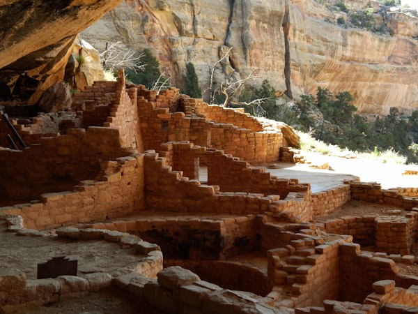 Ancient cliff dwelling ruins carved into sandstone overhang