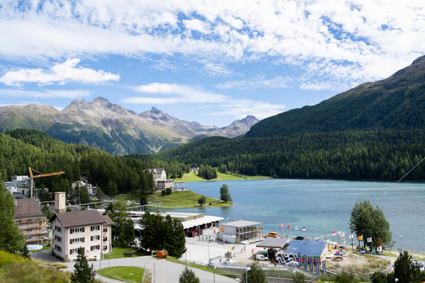 Lake surrounded by forest and mountains at St. Moritz