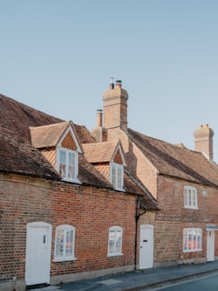Row of traditional brick houses under a clear sky