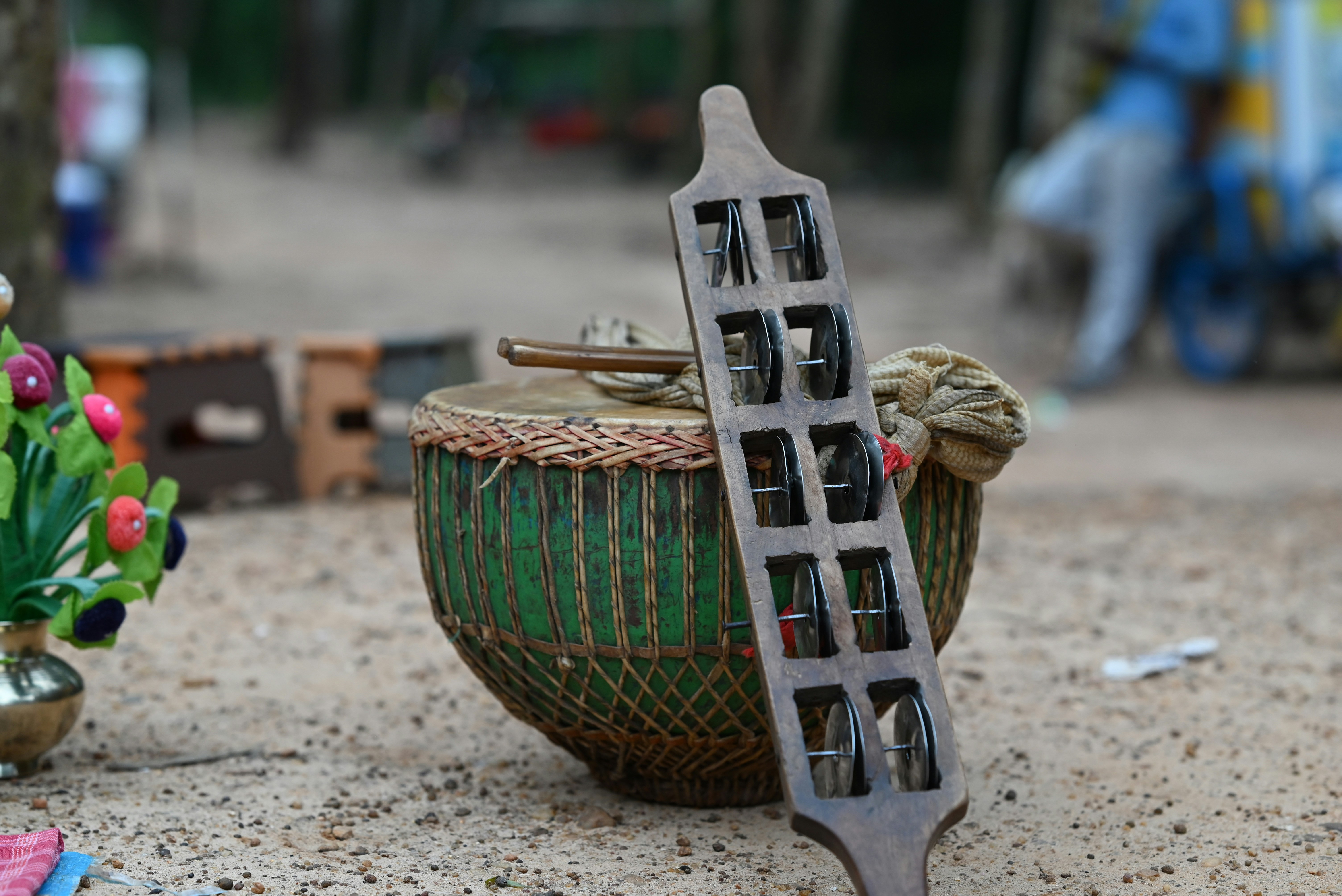 Wooden instrument rests on a drum