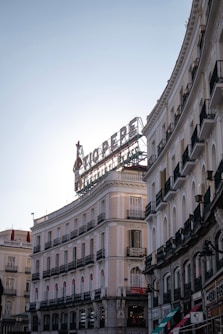 Tio pepe sign above curved buildings in madrid