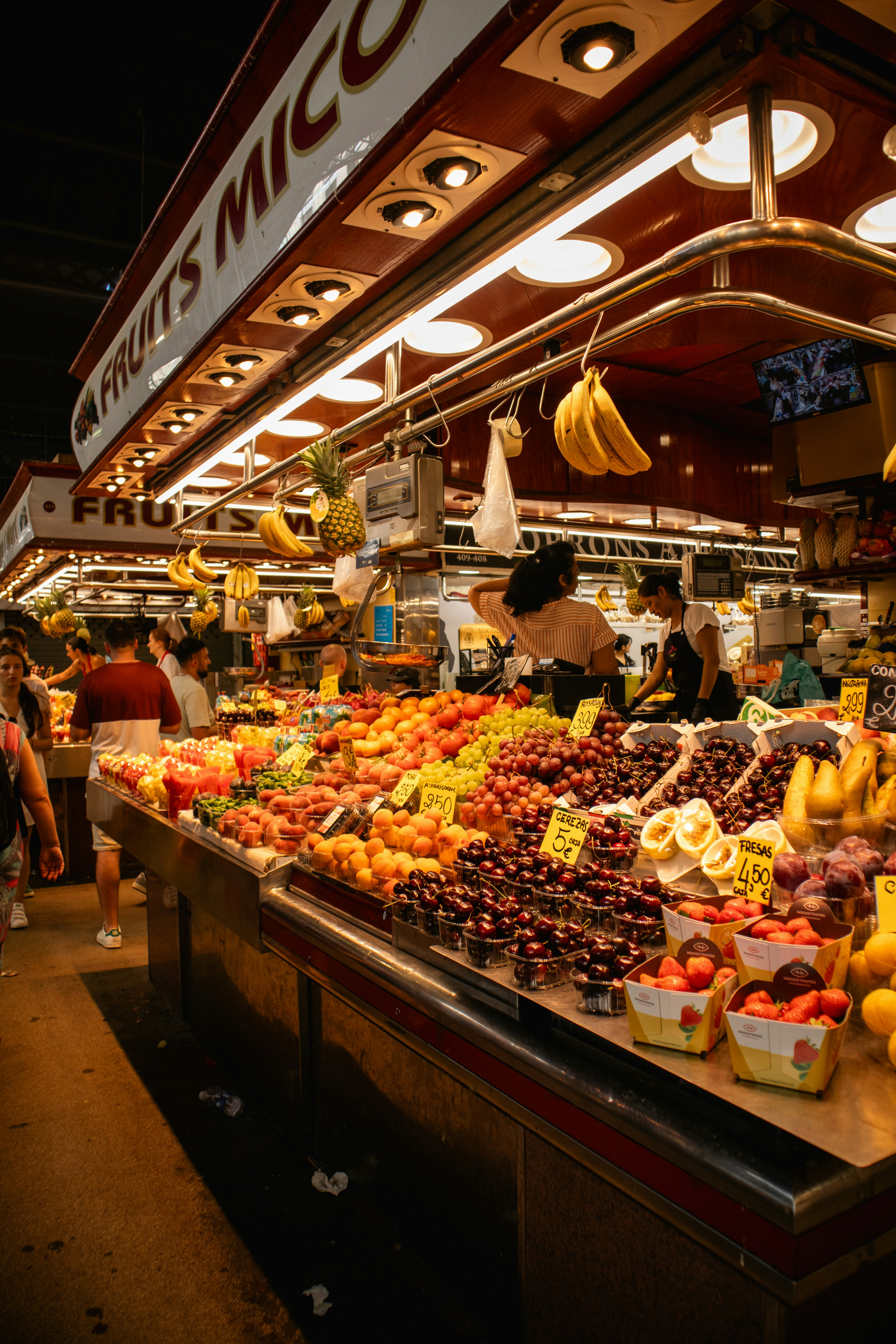 Abundant fresh fruits displayed at a market stall.
