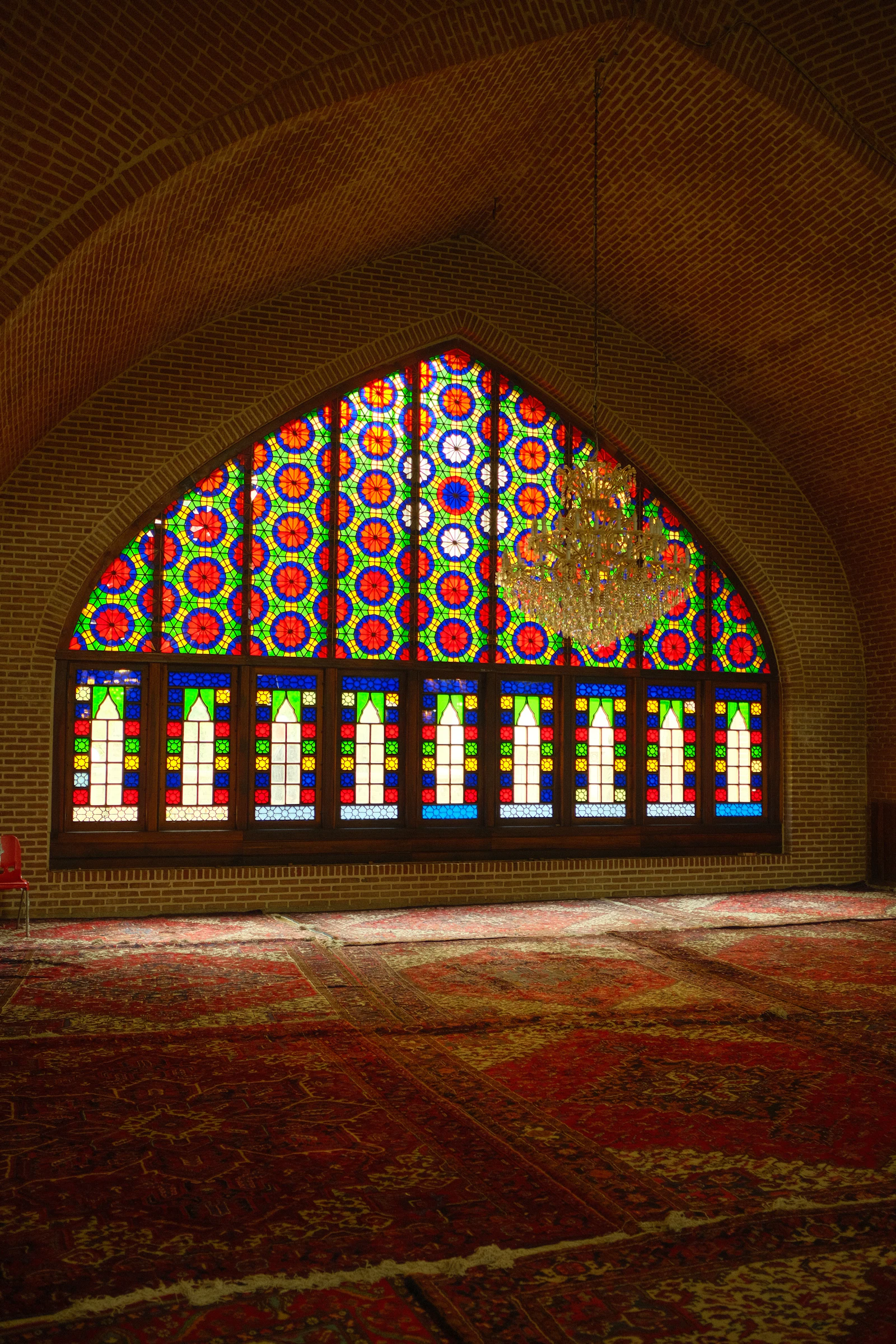 Colorful stained glass window in a mosque interior