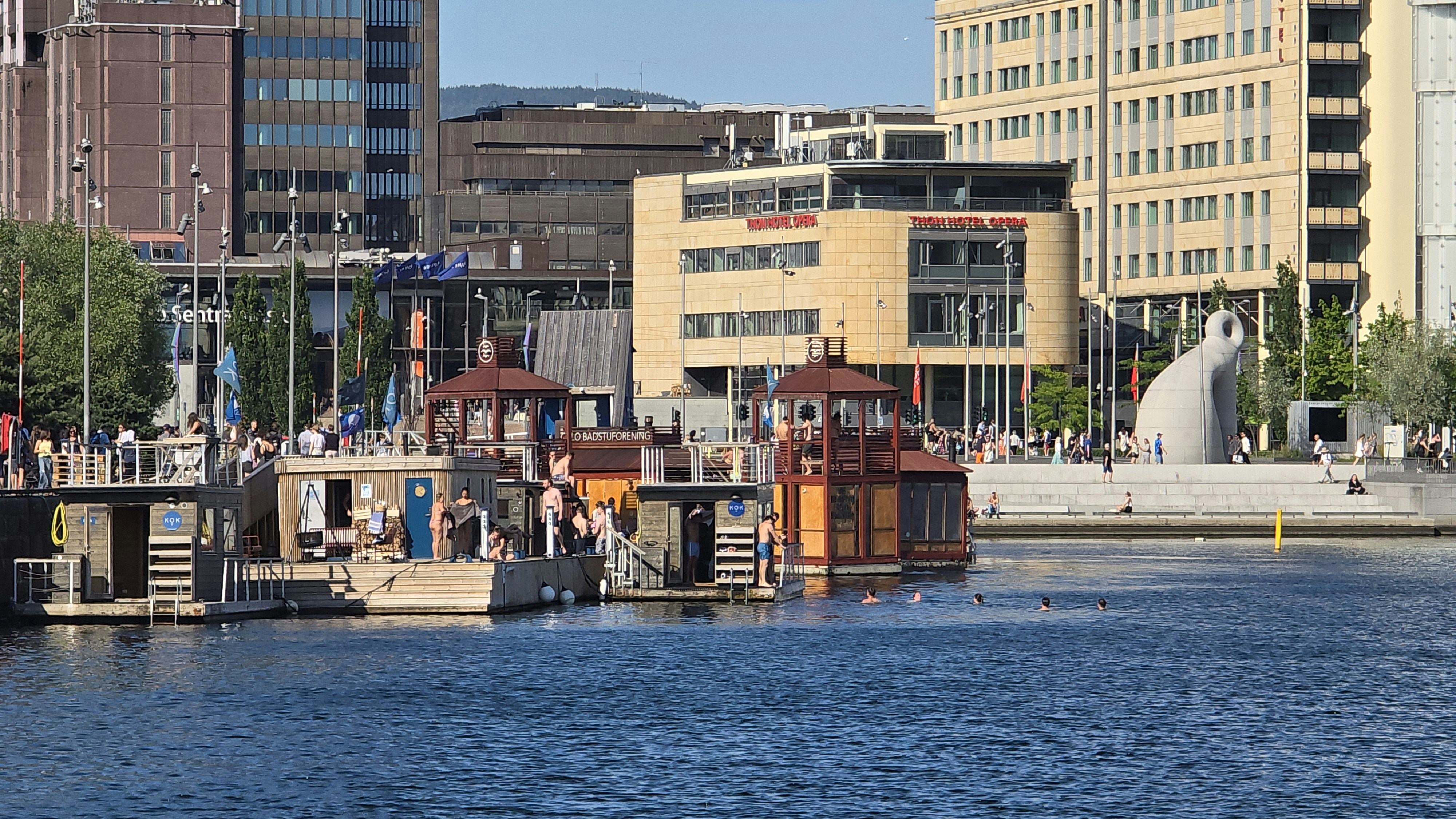 Boats and buildings along a blue waterfront
