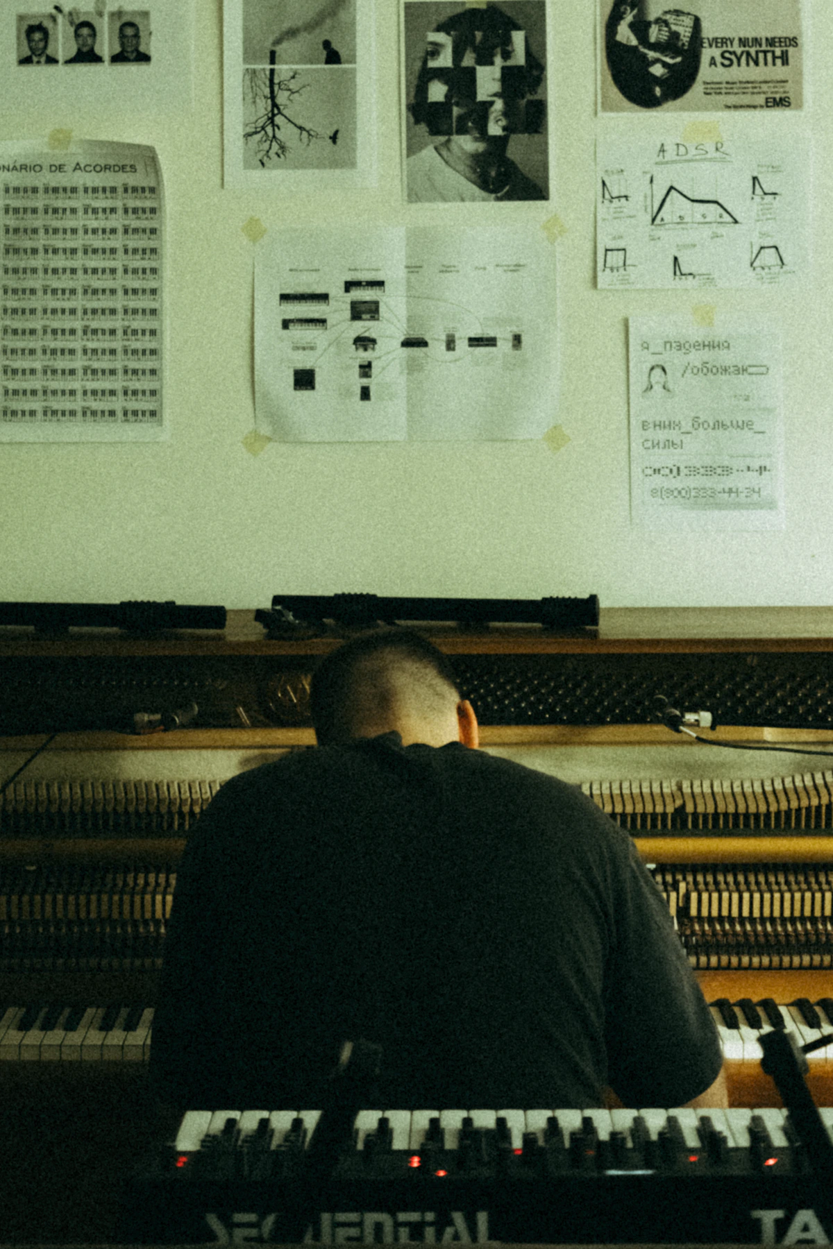 Musician playing a synthesizer keyboard