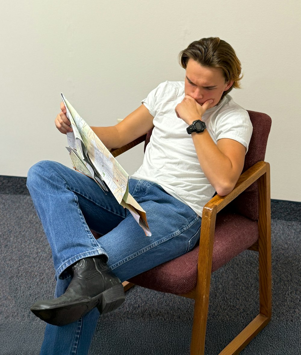 Person reading a printed leaflet at home