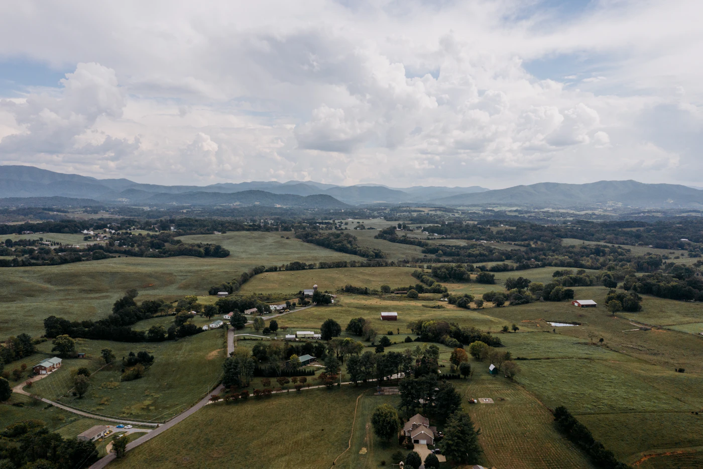 Rolling green Tennessee hills with scattered homes