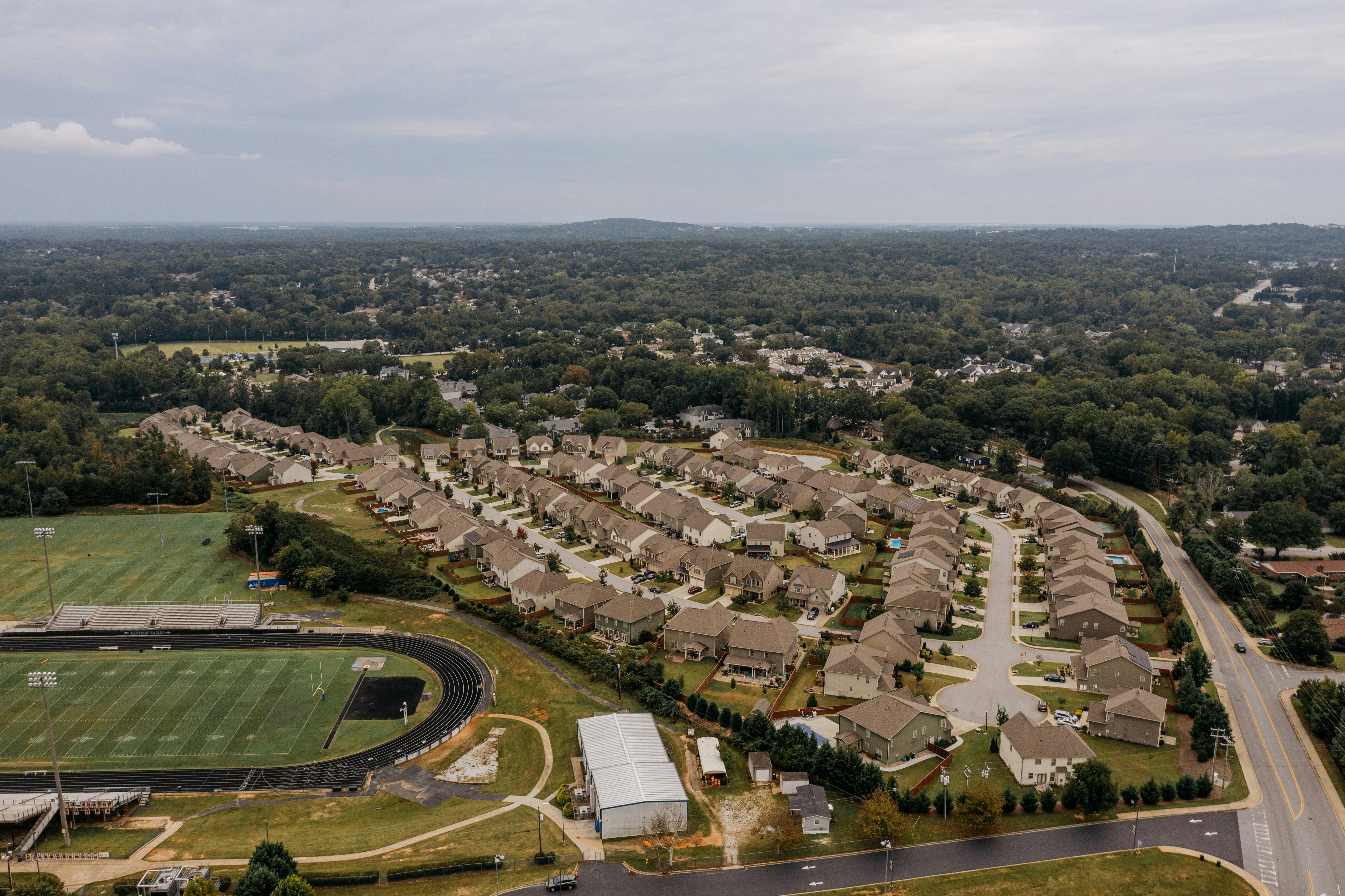 Aerial view neighborhood with sports field