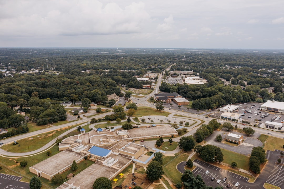 Aerial view of a suburban area with buildings and trees.