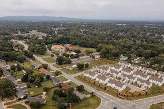 Aerial view of suburban neighborhood with houses and trees.
