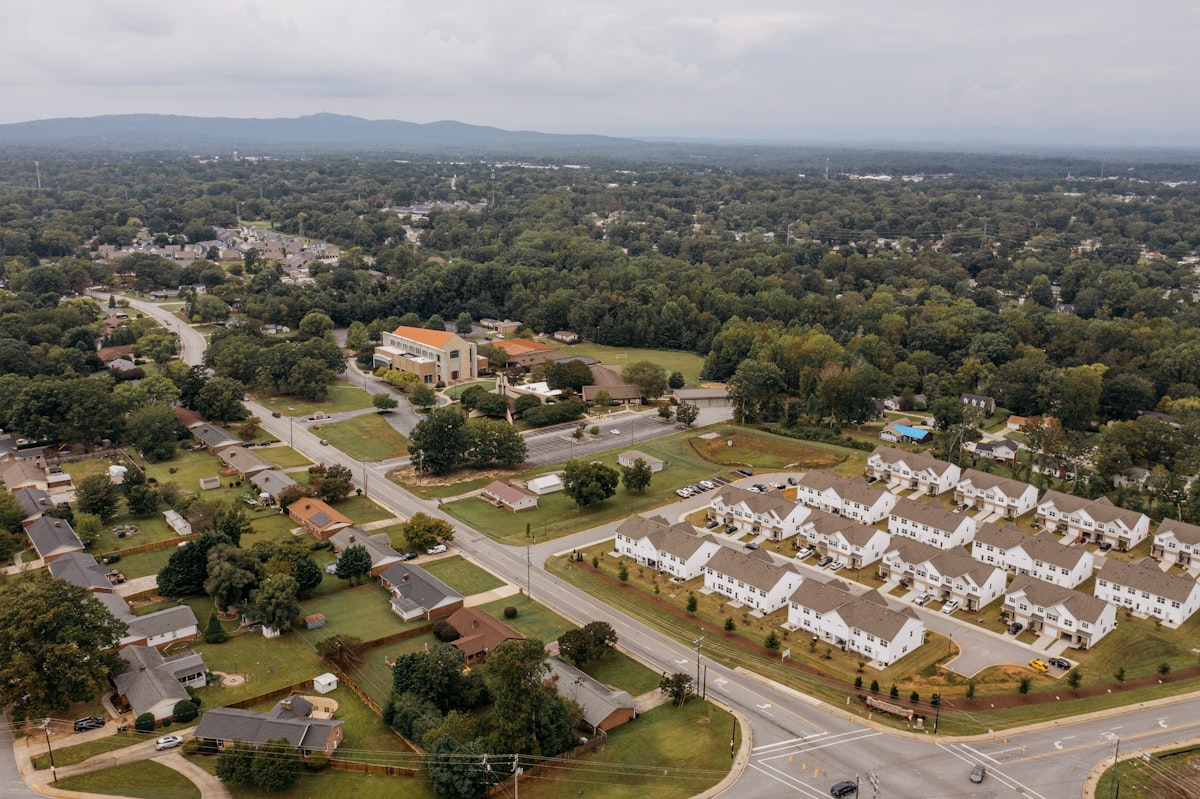 Aerial view of suburban neighborhood with houses and trees - Best neighborhoods around Lake Norman