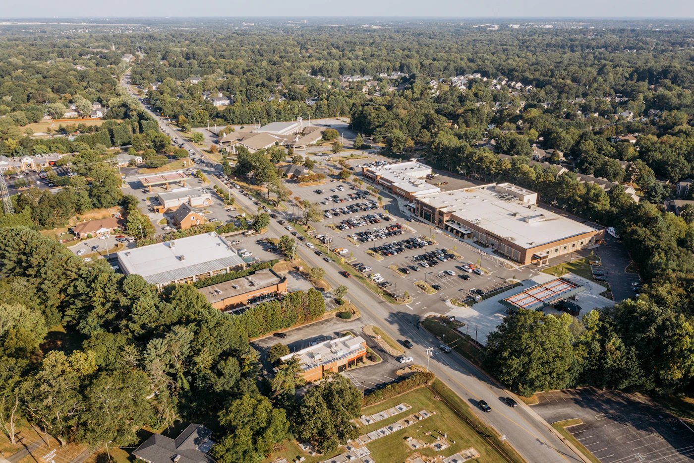 Aerial view of suburban commercial buildings and parking