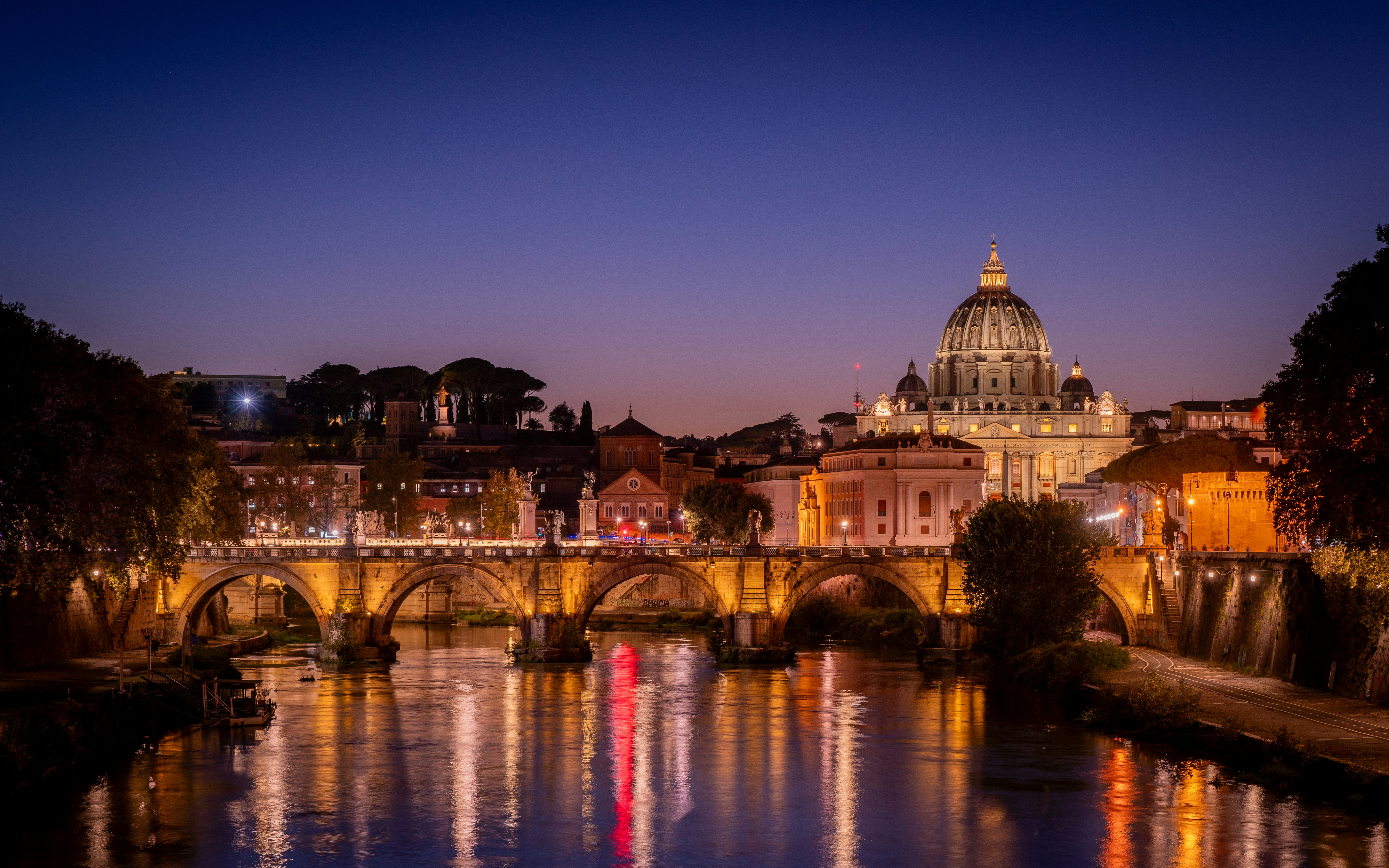 Cityscape with bridge and dome at dusk