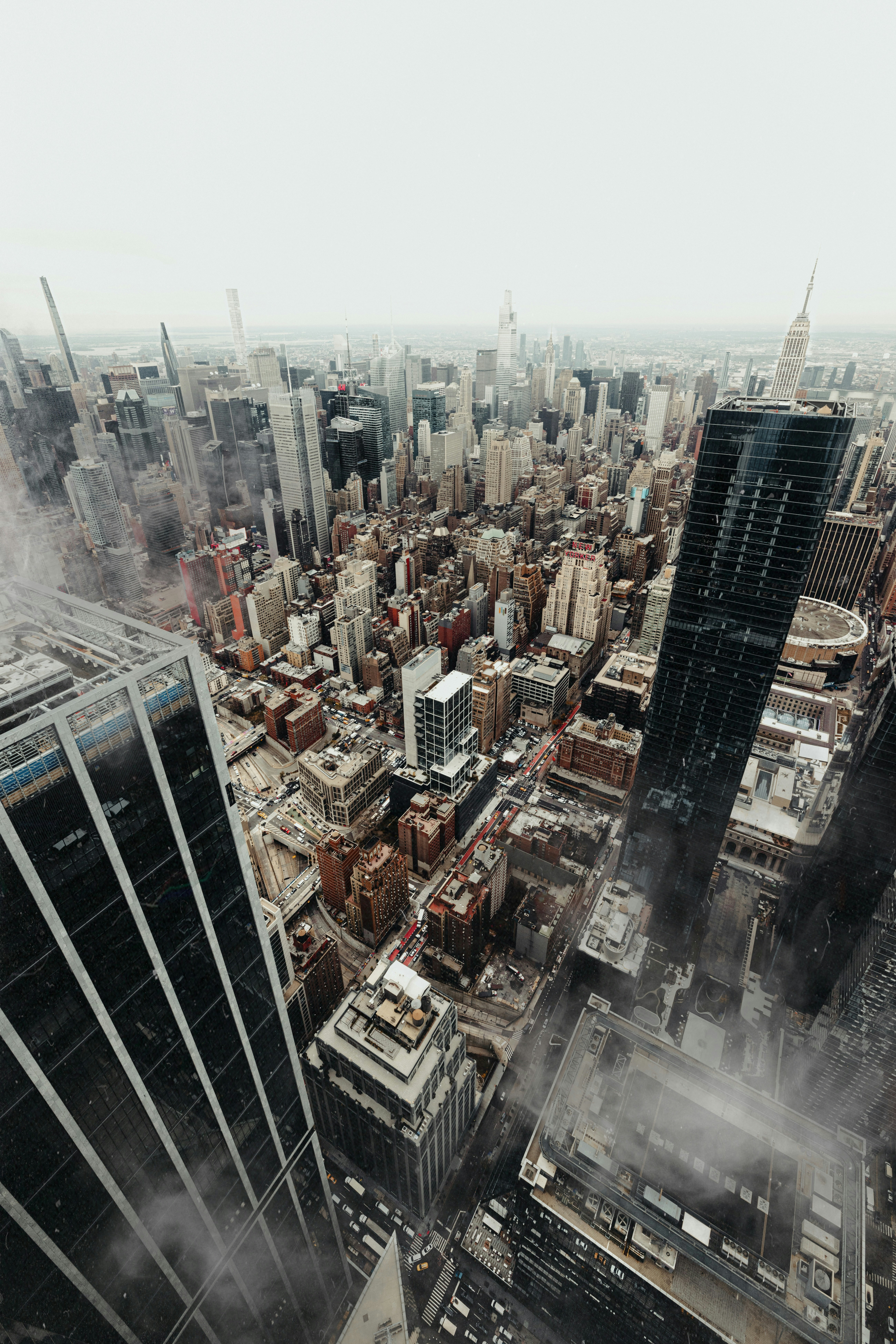 Aerial view of a dense cityscape with tall buildings.