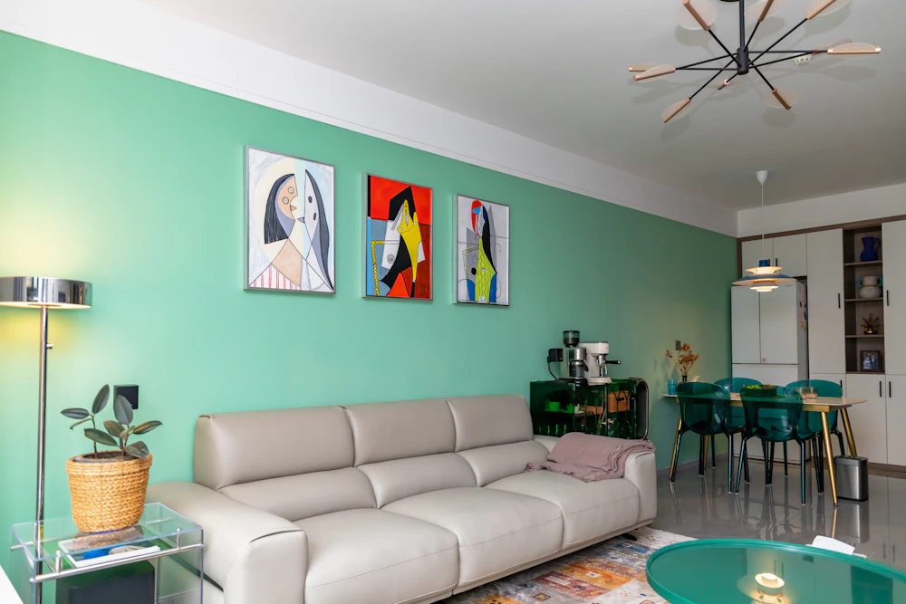 Living room with a calm green painted wall