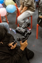 Person filming with a professional camera and gimbal.