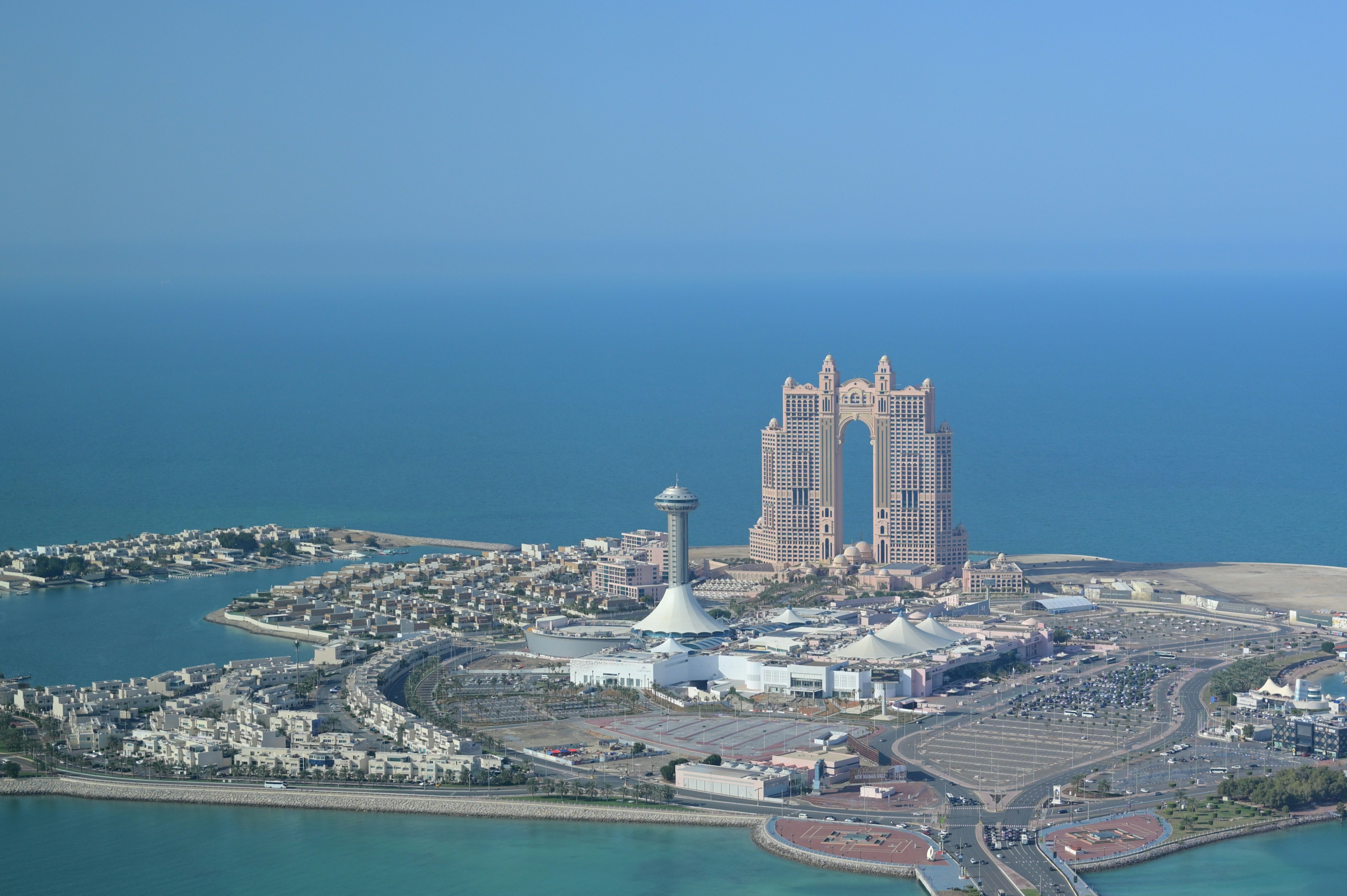 Modern city skyline with distinctive architecture on the coast.