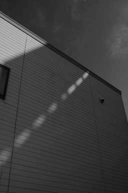 Building exterior with sunlight reflections on wall