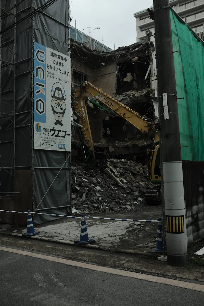 Excavator demolishing a building