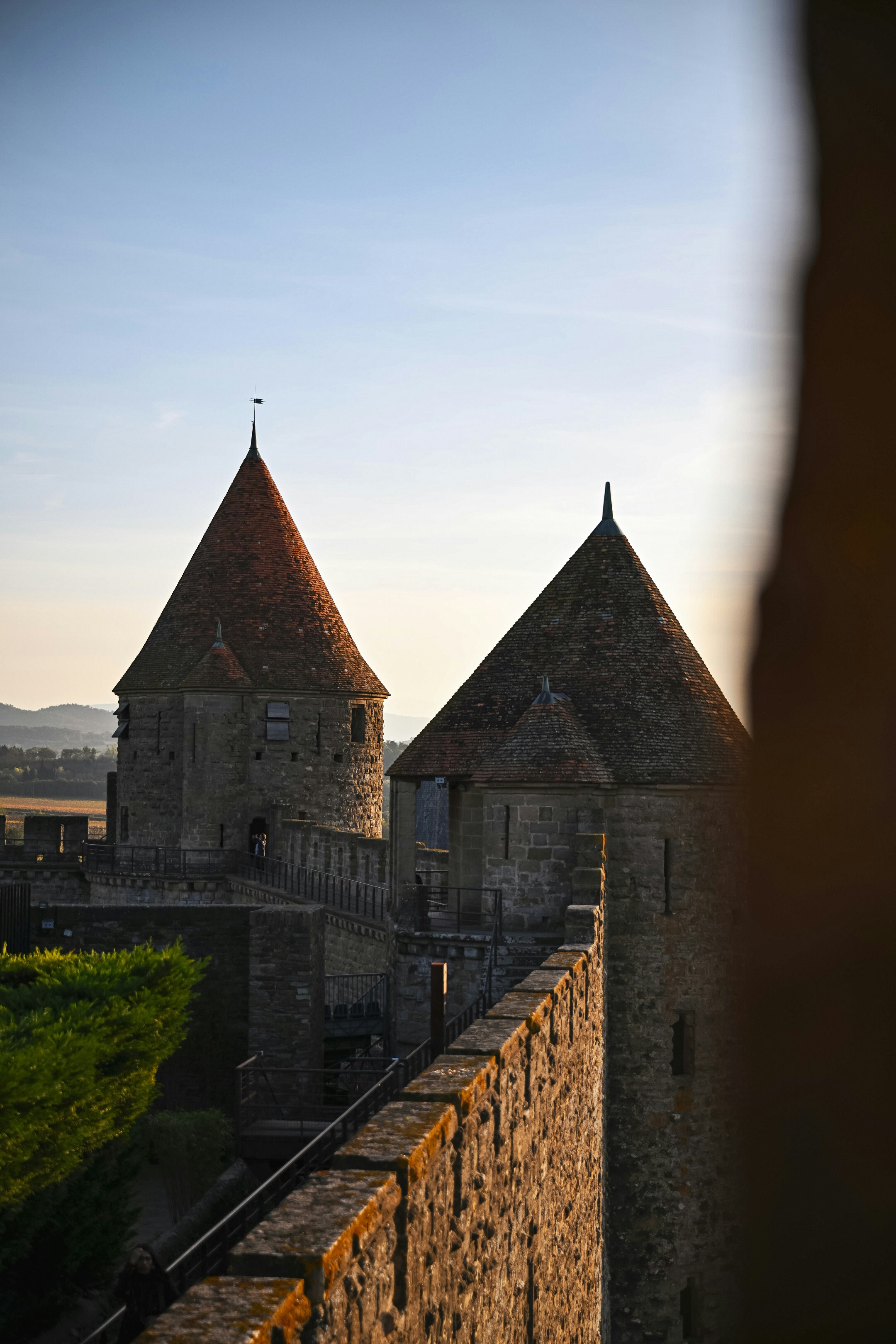 Stone castle towers at sunset