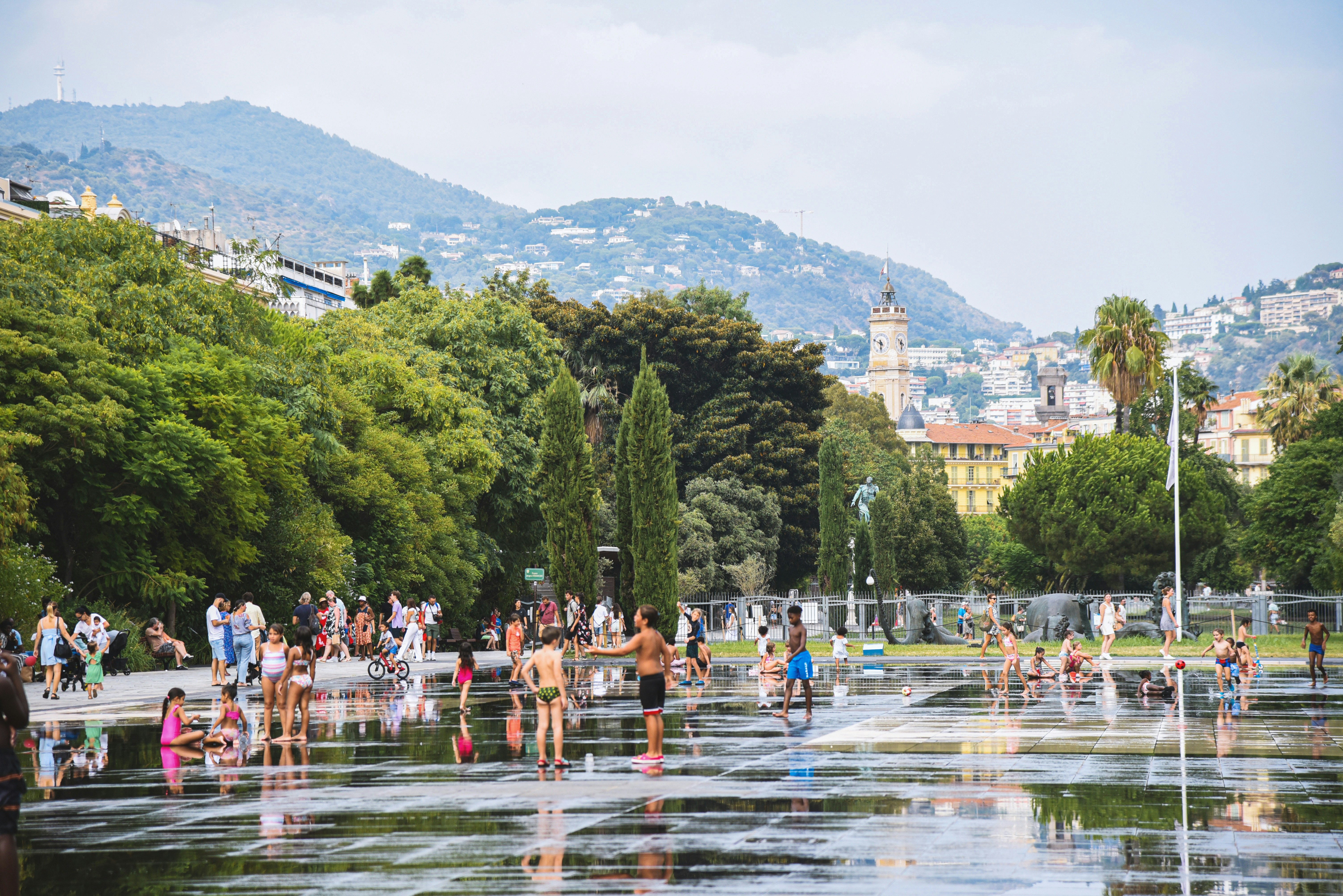 People cooling off in a water fountain park