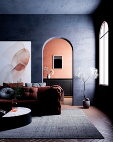 Modern living room with abstract art and archway.