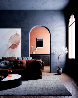 Modern living room with abstract art and archway.