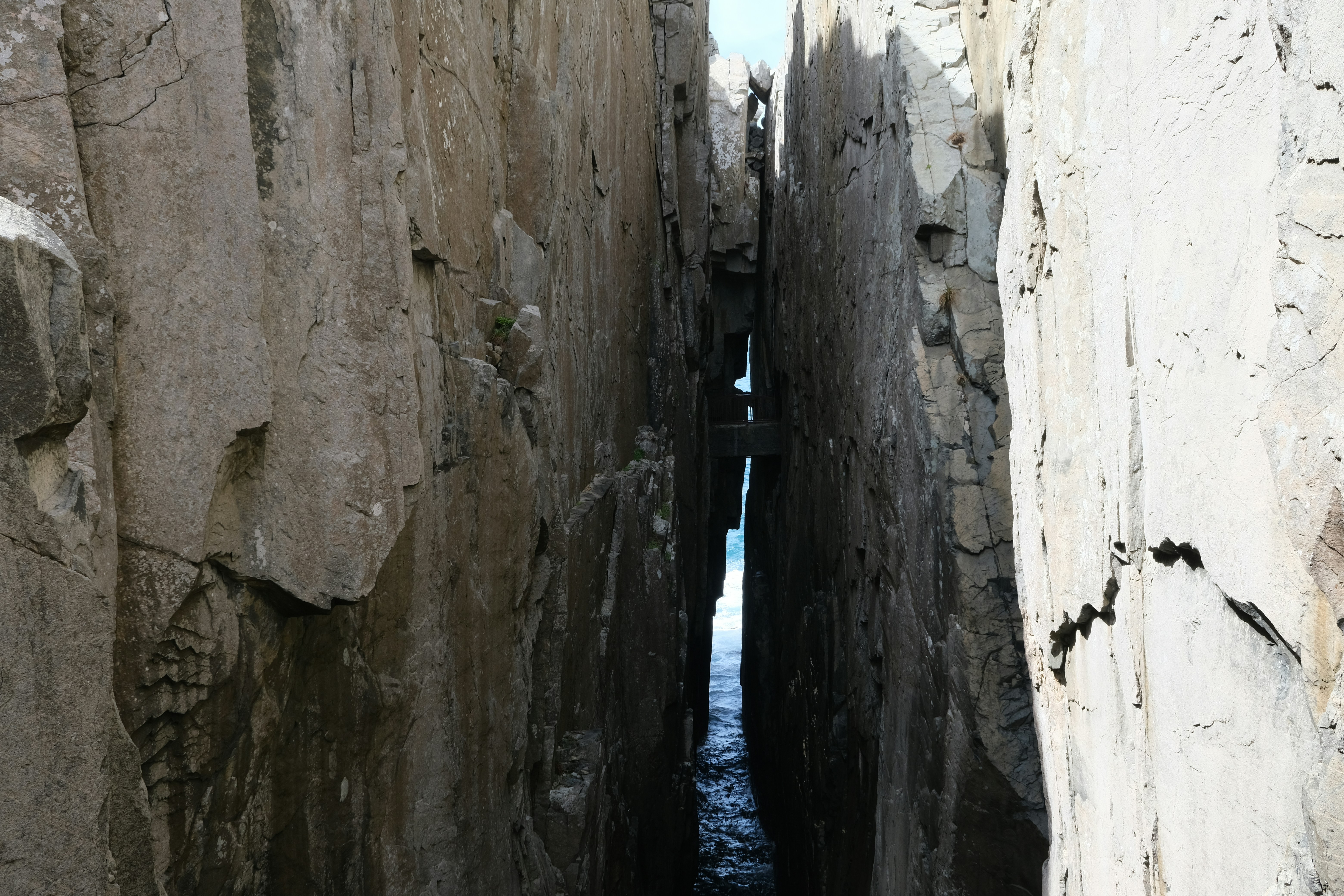 Narrow sea passage between tall rock formations