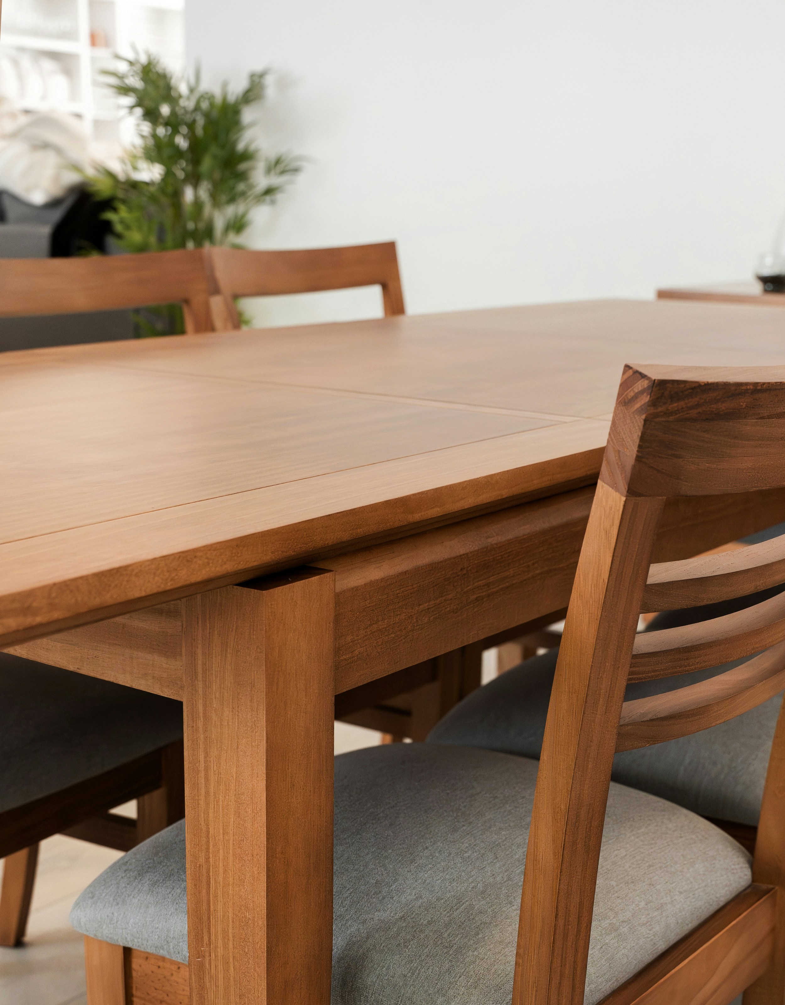 Wooden dining table with chairs and tableware