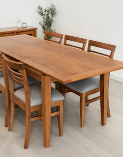 Wooden dining table with six upholstered chairs