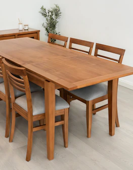 Wooden dining table with six upholstered chairs